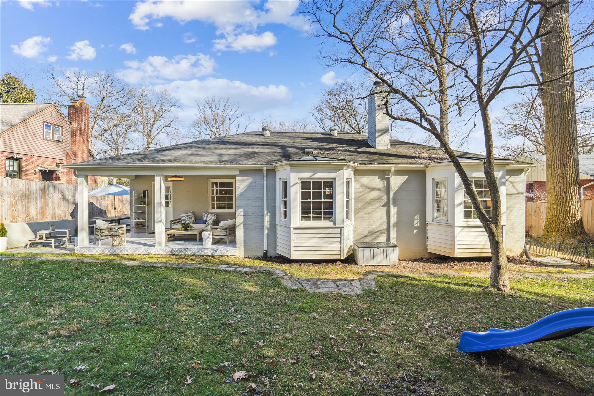 10206 Sutherland Road Silver Spring, MD 20901 - Photo 50 of 74 Back of house showcasing flat grassy area