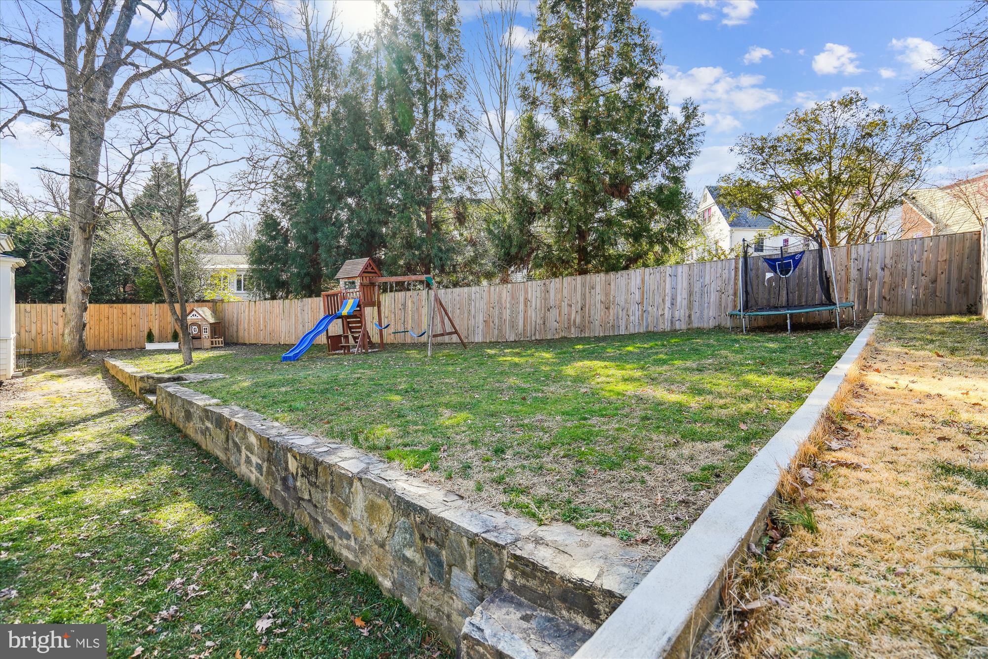 10206 Sutherland Road Silver Spring, MD 20901 - Photo 53 of 74 Elegant stone retaining wall gives levels to yard