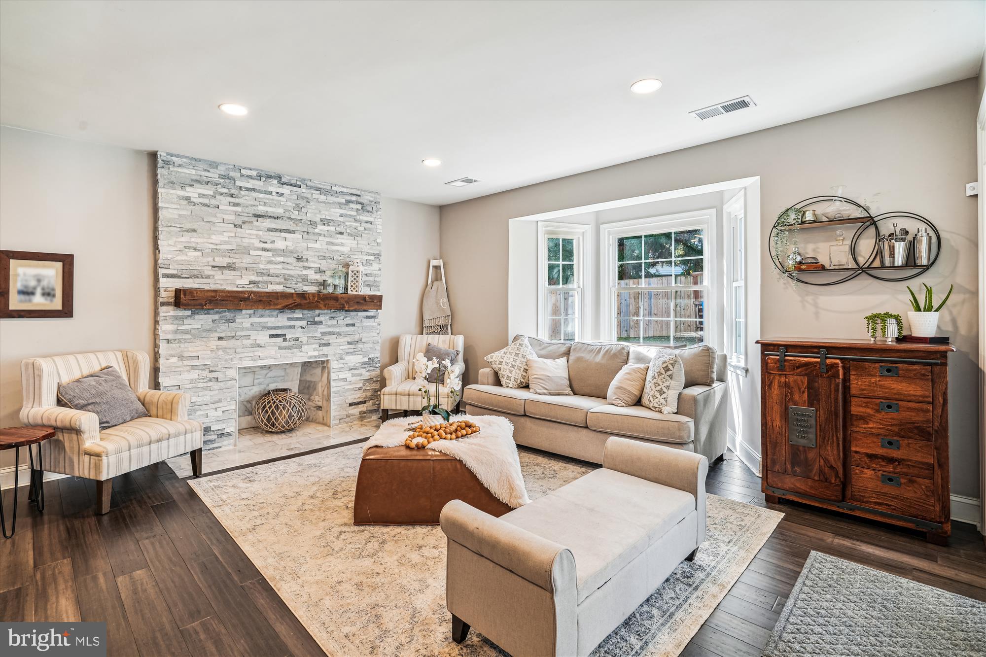 10206 Sutherland Road Silver Spring, MD 20901 - Photo 8 of 74 Stone fireplace & sunny bay window in living room