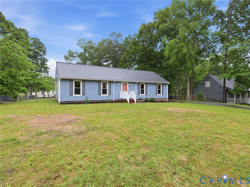 7707 Woodbrook Road Quinton, VA 23141 - Photo 3 of 42 Light blue siding exterior with a red front door,