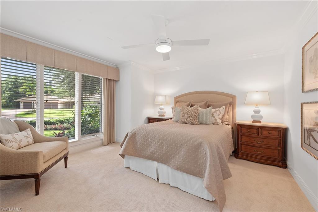 809 Buttonbush Lane Naples, FL 34108 - Photo 15 of 23 a bedroom with a bed and a large window