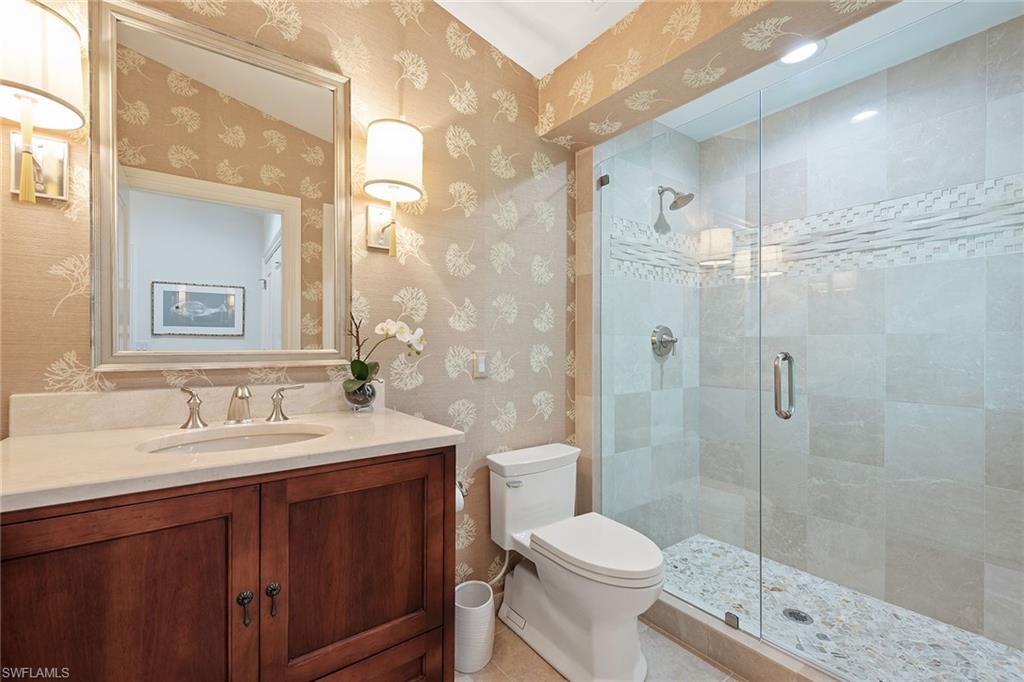 809 Buttonbush Lane Naples, FL 34108 - Photo 16 of 23 a bathroom with a sink a toilet and shower