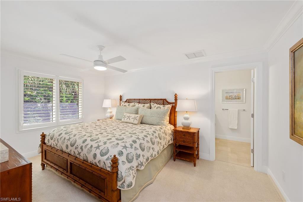 809 Buttonbush Lane Naples, FL 34108 - Photo 17 of 23 a bedroom with a bed and a window