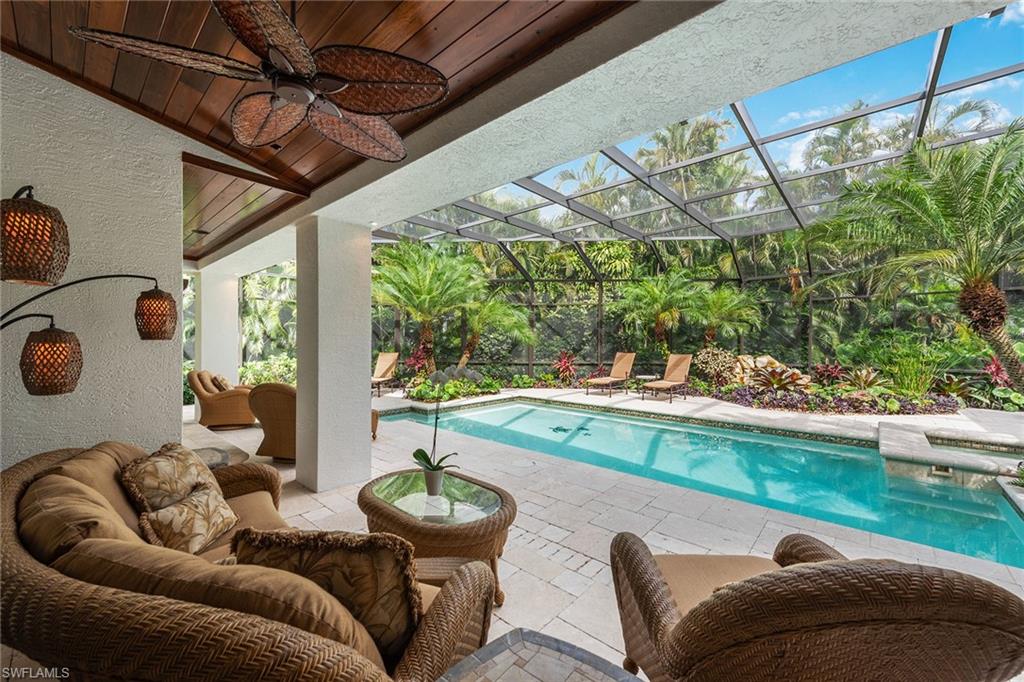 809 Buttonbush Lane Naples, FL 34108 - Photo 20 of 23 a living room with furniture and a large window