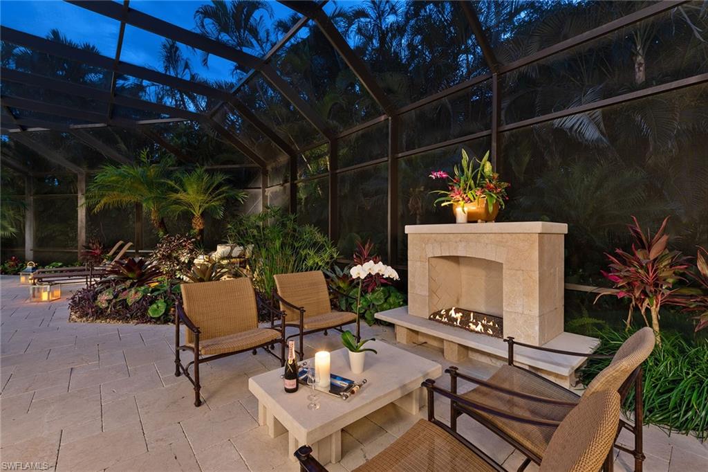 809 Buttonbush Lane Naples, FL 34108 - Photo 2 of 23 a view of a tables and chairs in patio