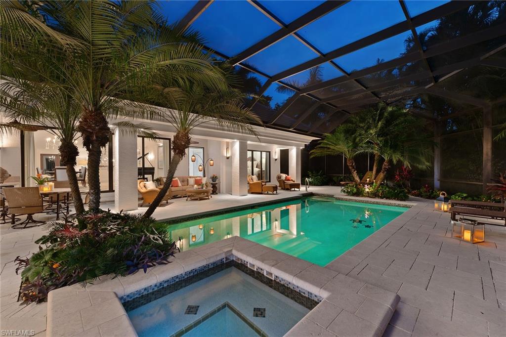 809 Buttonbush Lane Naples, FL 34108 - Photo 21 of 23 a view of a swimming pool with a patio