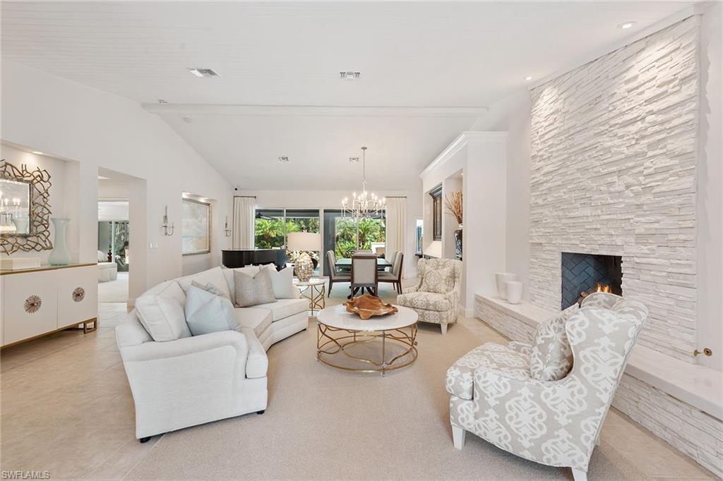 809 Buttonbush Lane Naples, FL 34108 - Photo 4 of 23 a living room with furniture and a fireplace