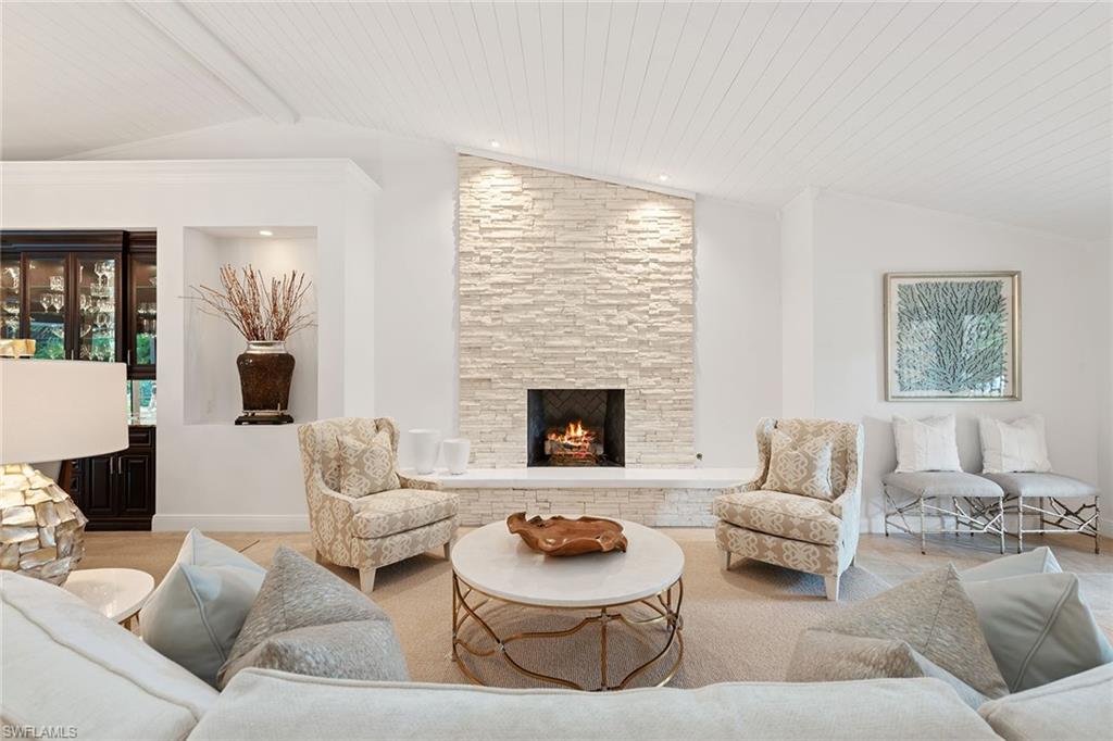 809 Buttonbush Lane Naples, FL 34108 - Photo 5 of 23 a living room with furniture and a fireplace