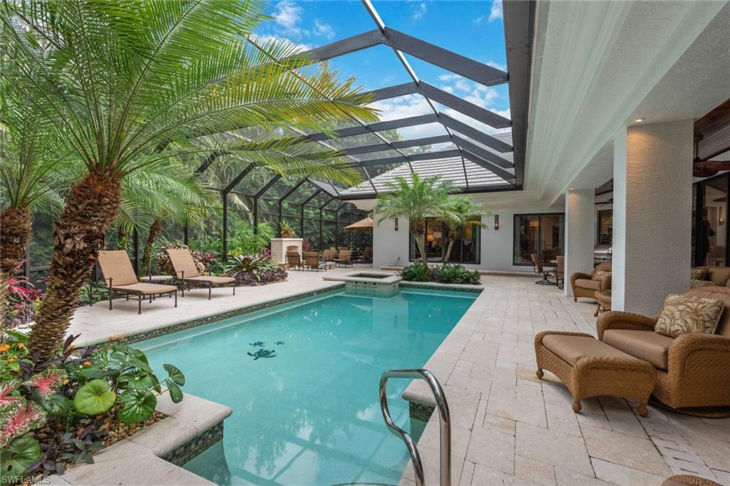 809 Buttonbush Lane Naples, FL 34108 - Photo 10 of 23 a view of a house with swimming pool and sitting area