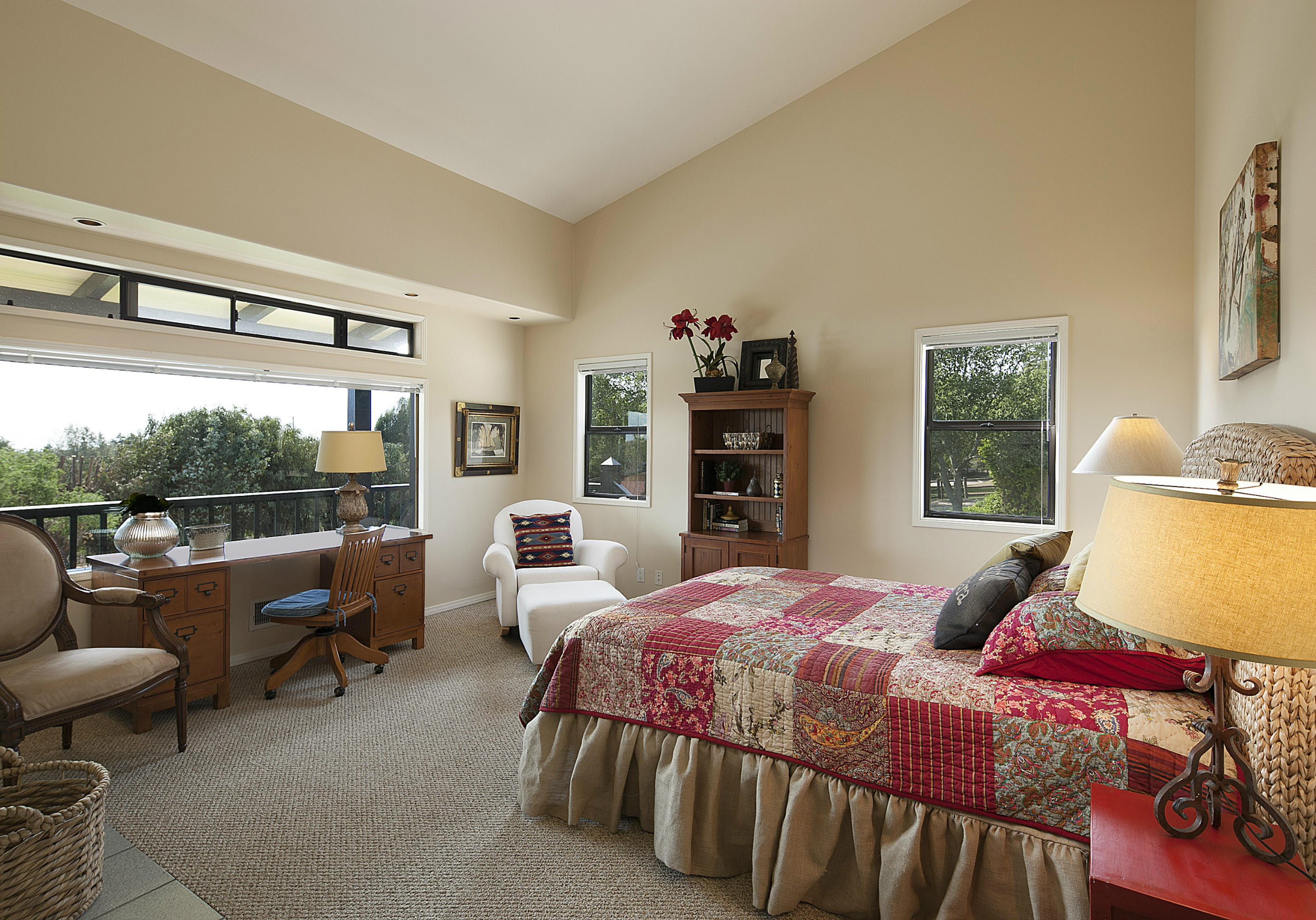 340 Toro Canyon Road Carpinteria, CA 93013 - Photo 13 of 14 a bedroom with a bed a couch and a window