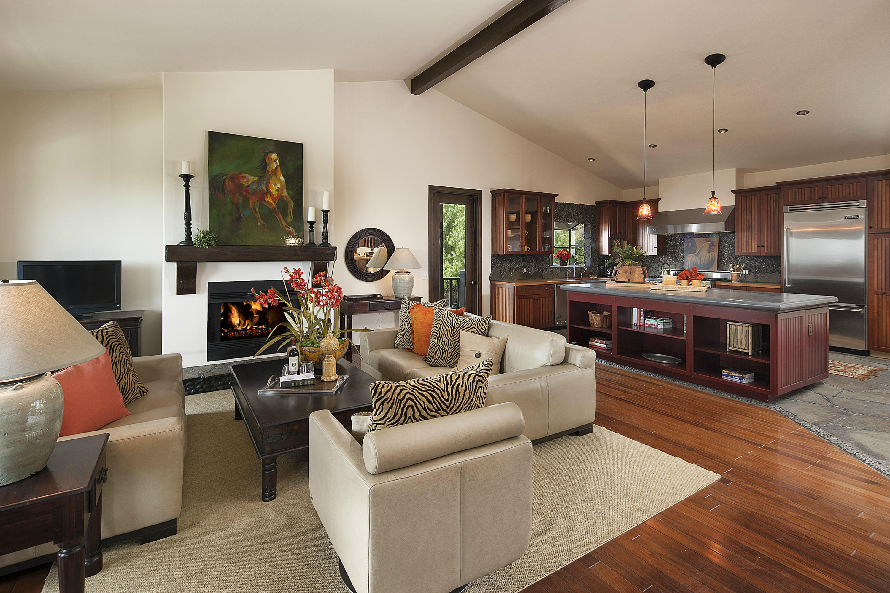340 Toro Canyon Road Carpinteria, CA 93013 - Photo 2 of 14 a living room with fireplace furniture and a wooden floor