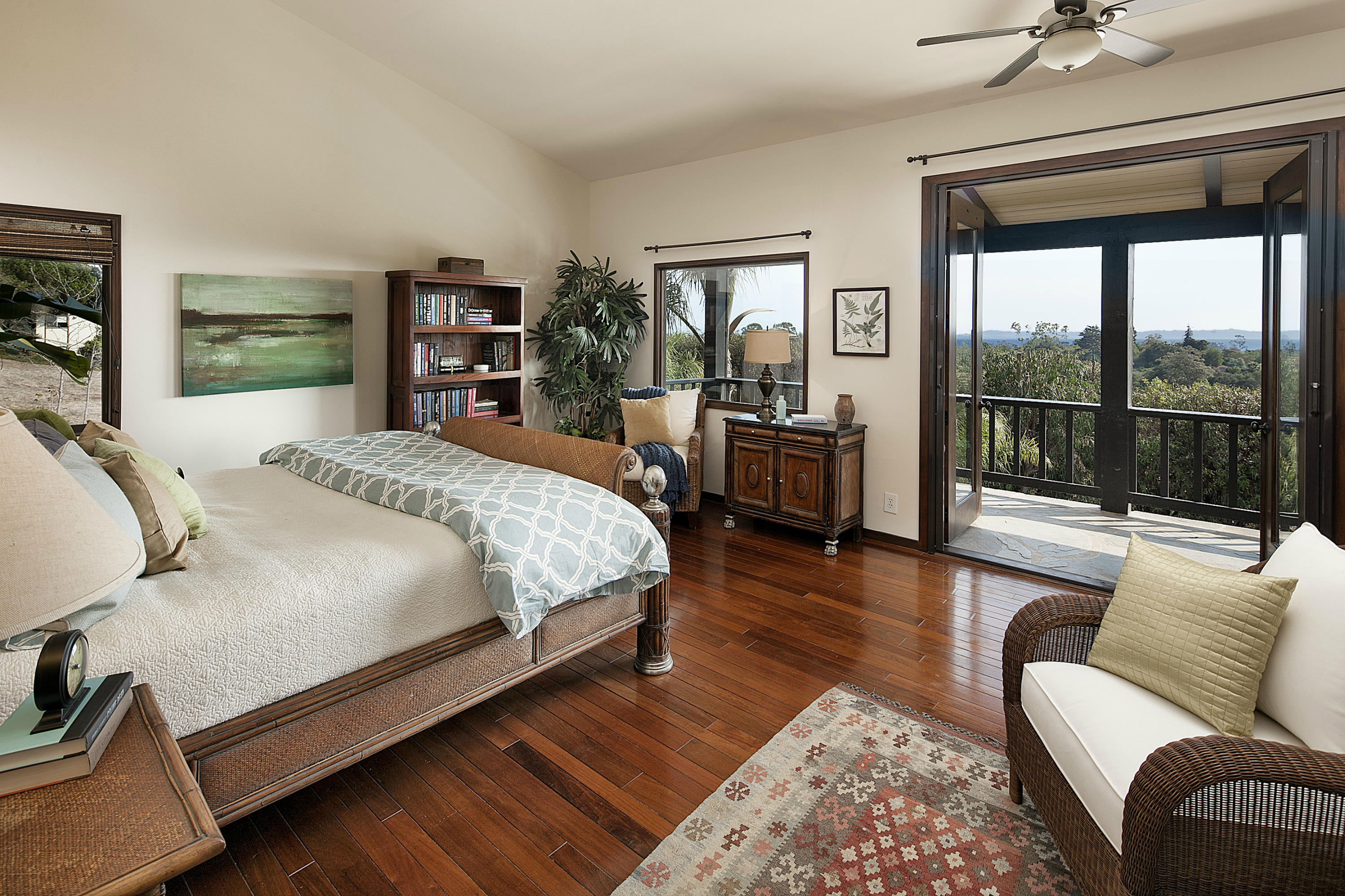 340 Toro Canyon Road Carpinteria, CA 93013 - Photo 5 of 14 a bedroom with a large bed and a couch