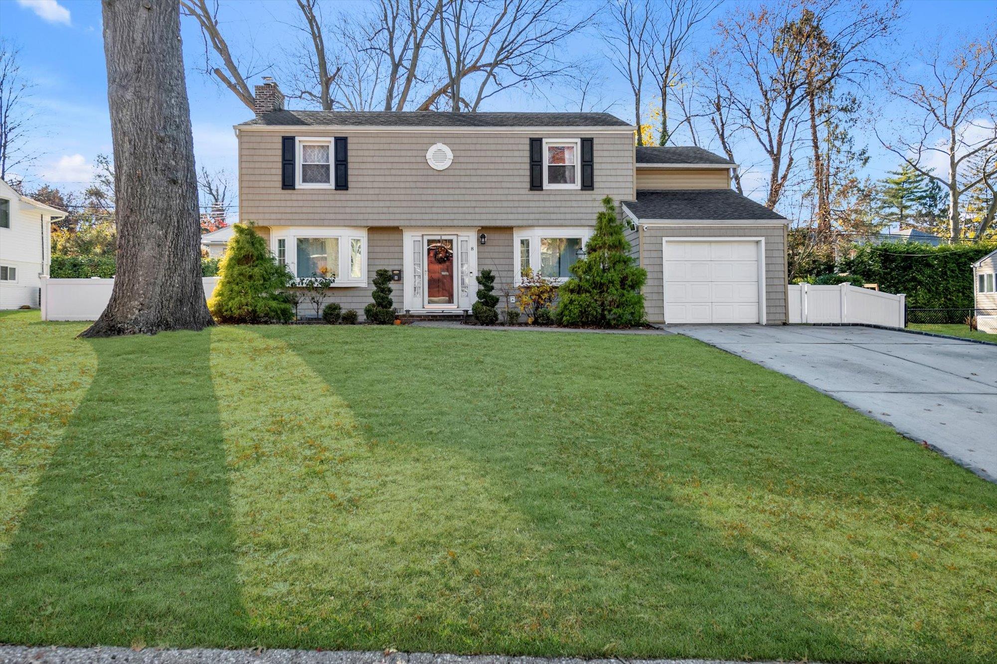 8 Oaks Hunt Road Great Neck, NY 11020 - Photo 1 of 1 Colonial inspired home with a front lawn and a garage