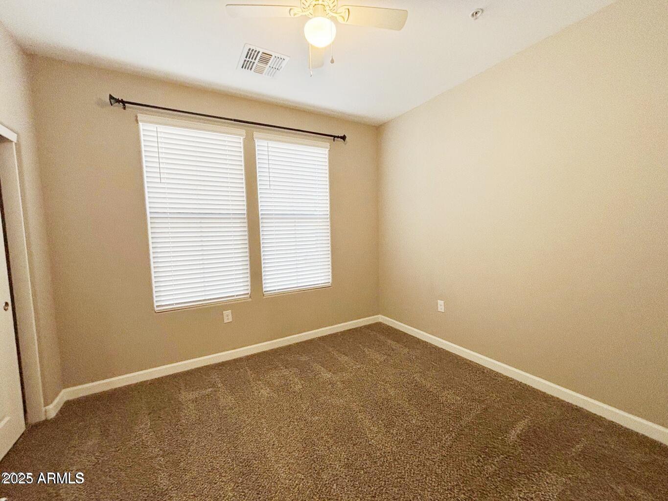 1255 North Arizona Avenue, Unit 1124 Chandler, AZ 85225 - Photo 11 of 29 a view of an empty room with a window
