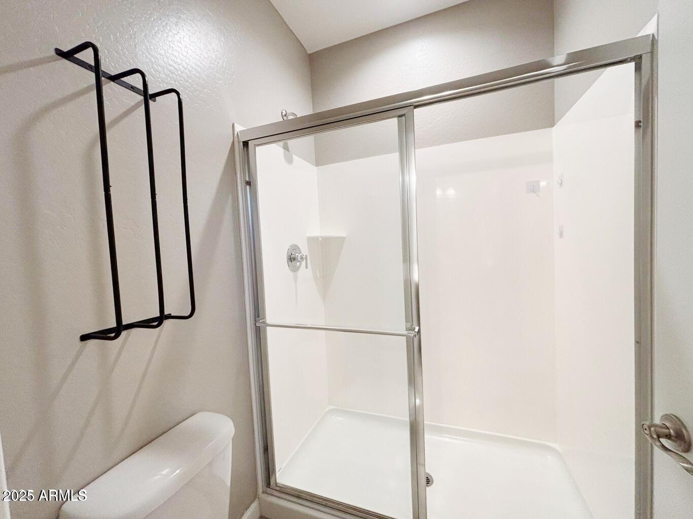 1255 North Arizona Avenue, Unit 1124 Chandler, AZ 85225 - Photo 14 of 29 a bathroom with a shower and a toilet