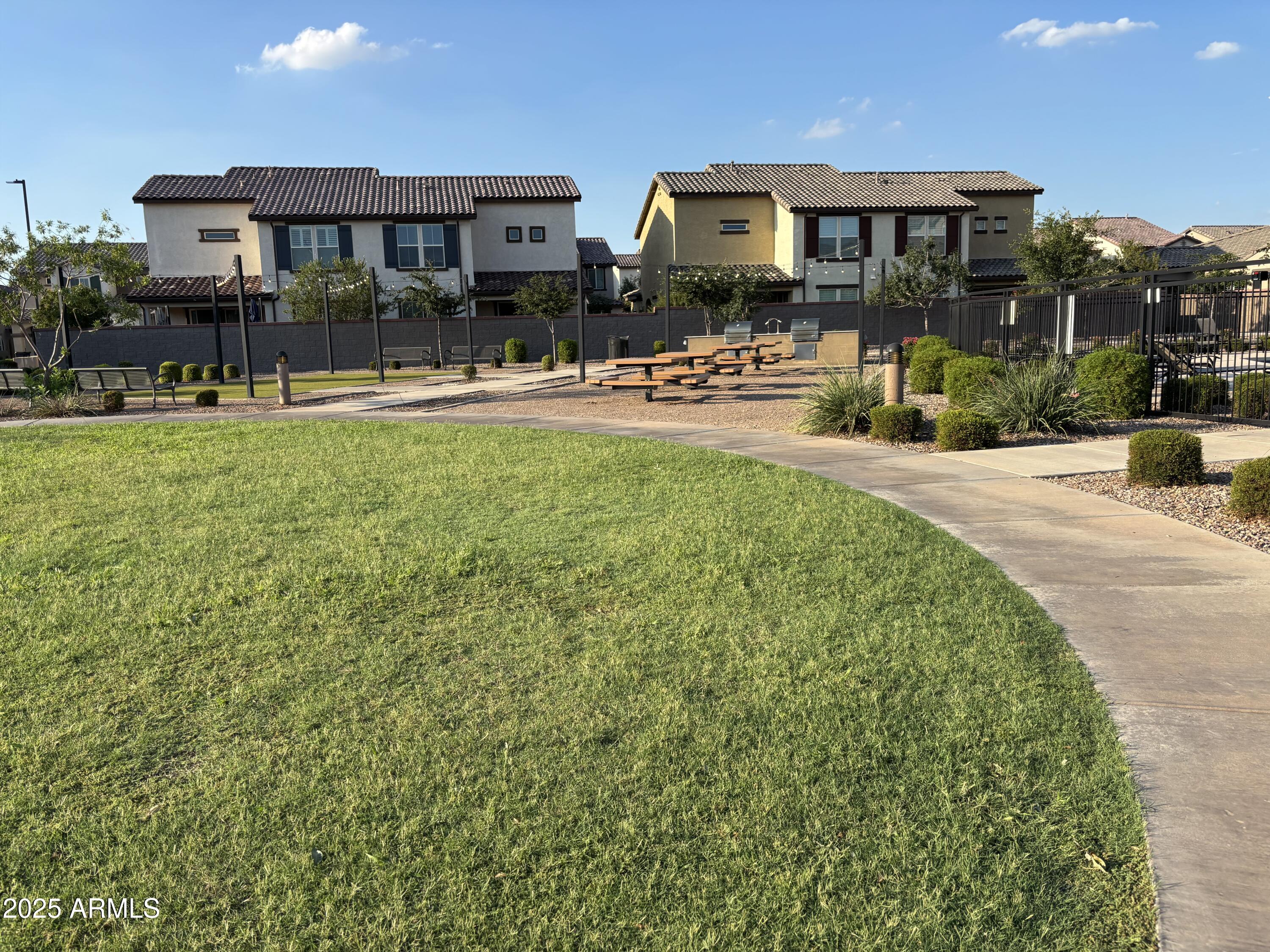 1255 North Arizona Avenue, Unit 1124 Chandler, AZ 85225 - Photo 16 of 29 a front view of a building with lots of green space