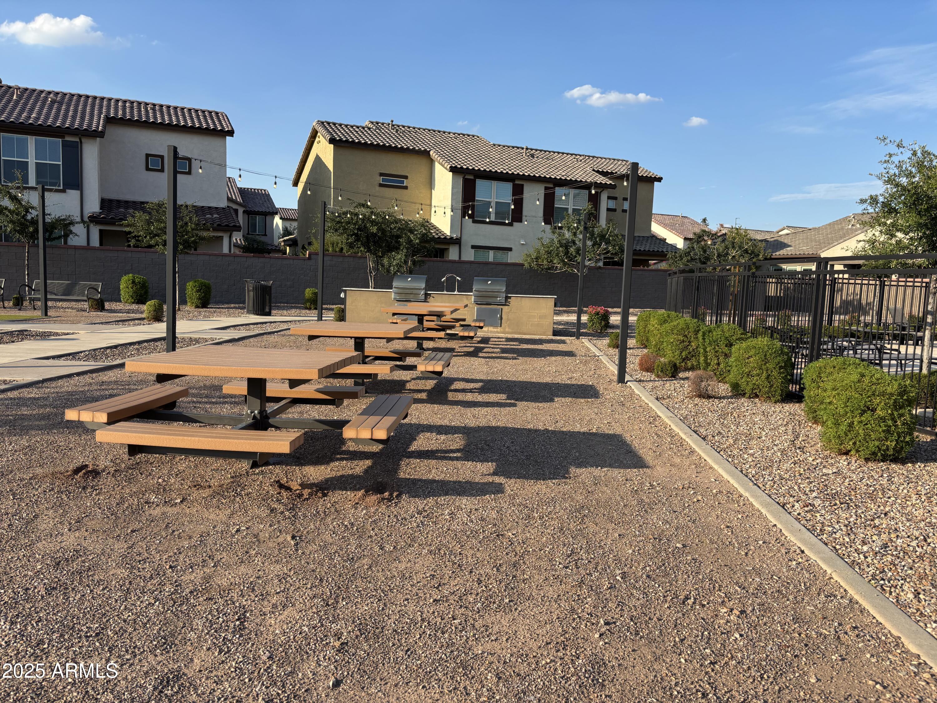 1255 North Arizona Avenue, Unit 1124 Chandler, AZ 85225 - Photo 17 of 29 a view of a patio with a table and chairs
