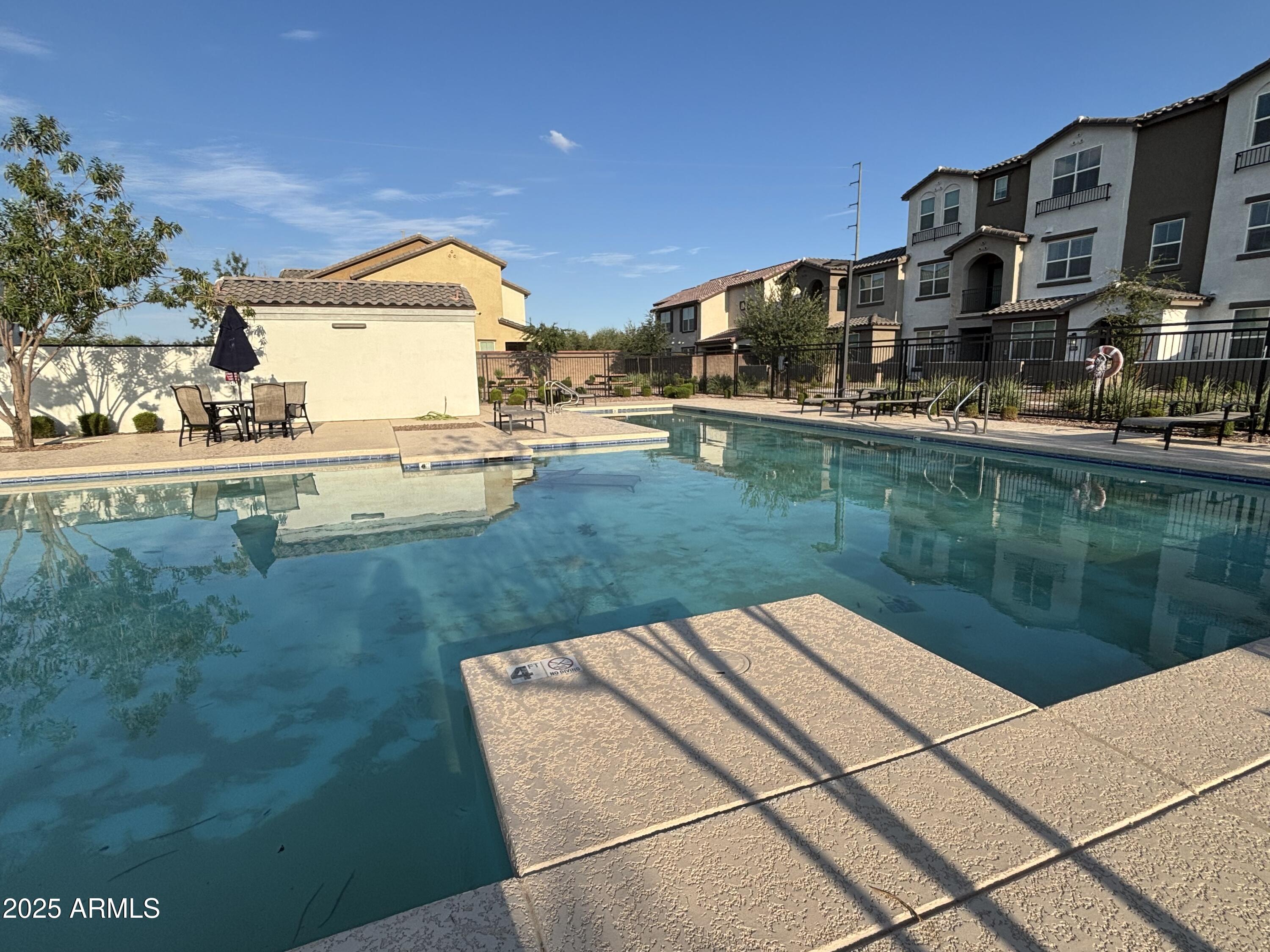 1255 North Arizona Avenue, Unit 1124 Chandler, AZ 85225 - Photo 19 of 29 a view of a lake with a house