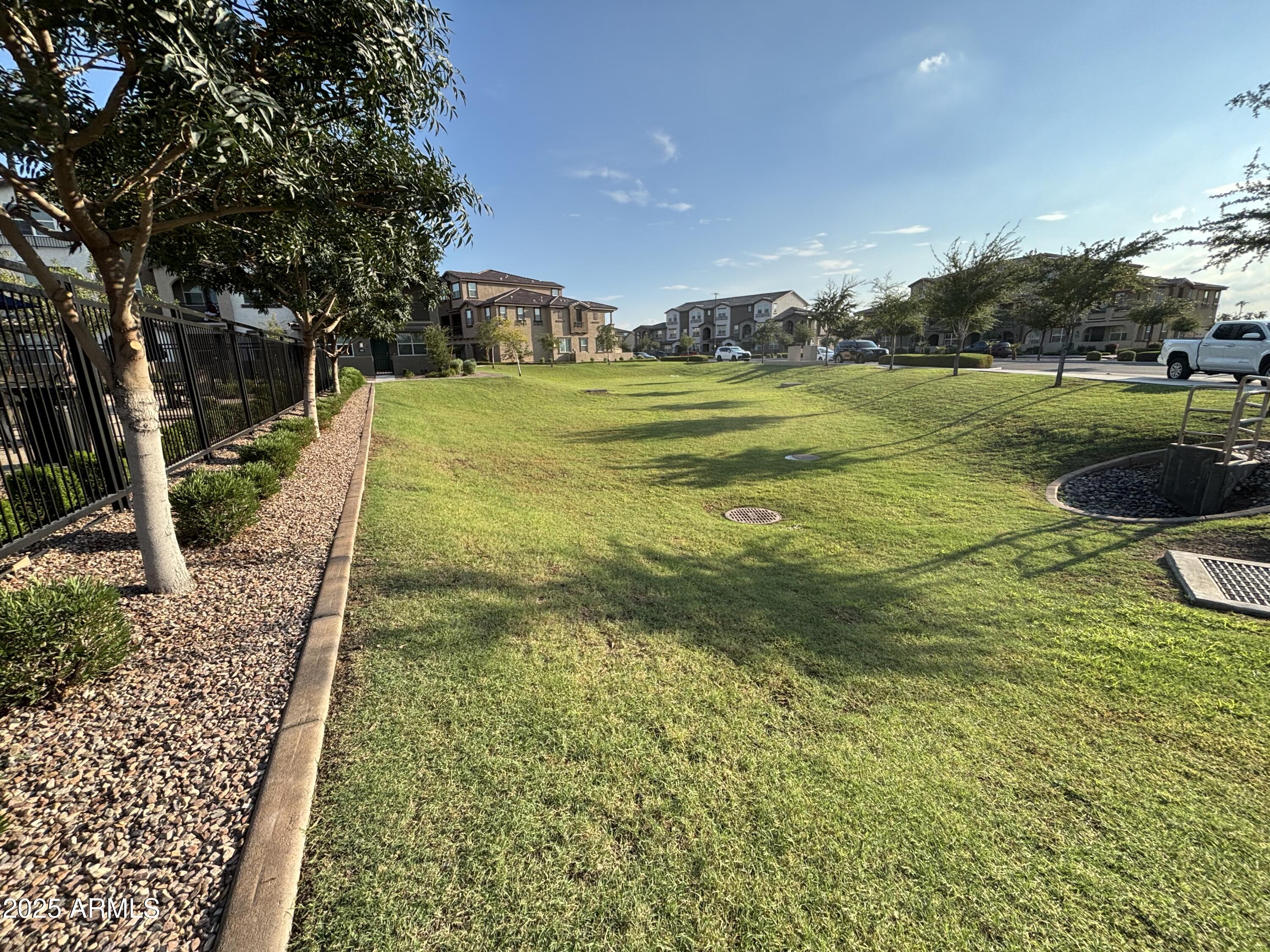 1255 North Arizona Avenue, Unit 1124 Chandler, AZ 85225 - Photo 21 of 29 a view of a yard with an outdoor space