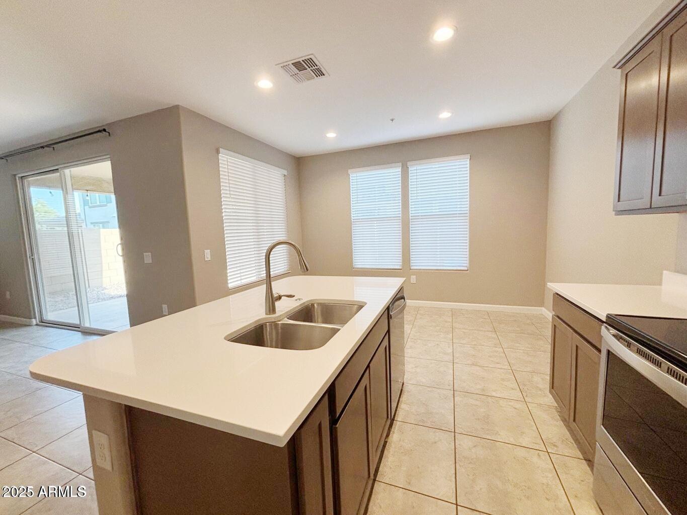 1255 North Arizona Avenue, Unit 1124 Chandler, AZ 85225 - Photo 6 of 29 a kitchen with a sink a counter top space and appliances