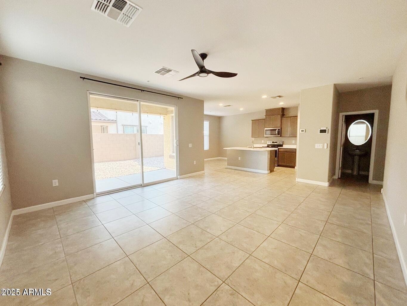 1255 North Arizona Avenue, Unit 1124 Chandler, AZ 85225 - Photo 8 of 29 a view of a kitchen with furniture and a ceiling fan