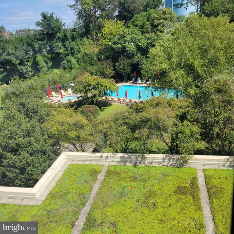 a view of a yard with an outdoor seating