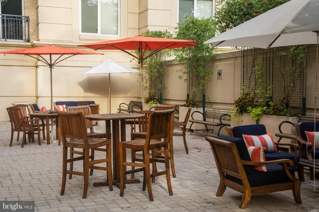 a view of a dinning table and chairs in the patio