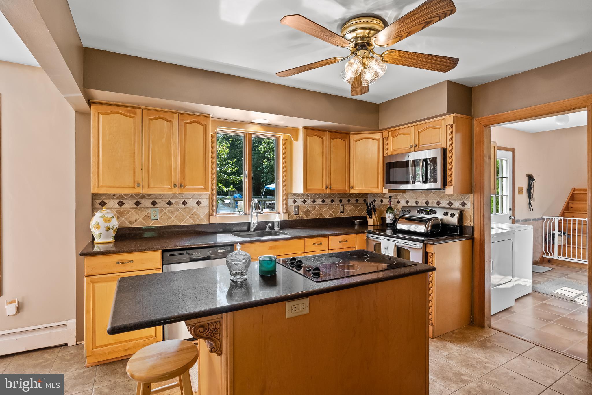 151 Patty Bowker Road Tabernacle, NJ 08088 - Photo 12 of 52 a kitchen with stainless steel appliances granite countertop a stove a sink and a refrigerator