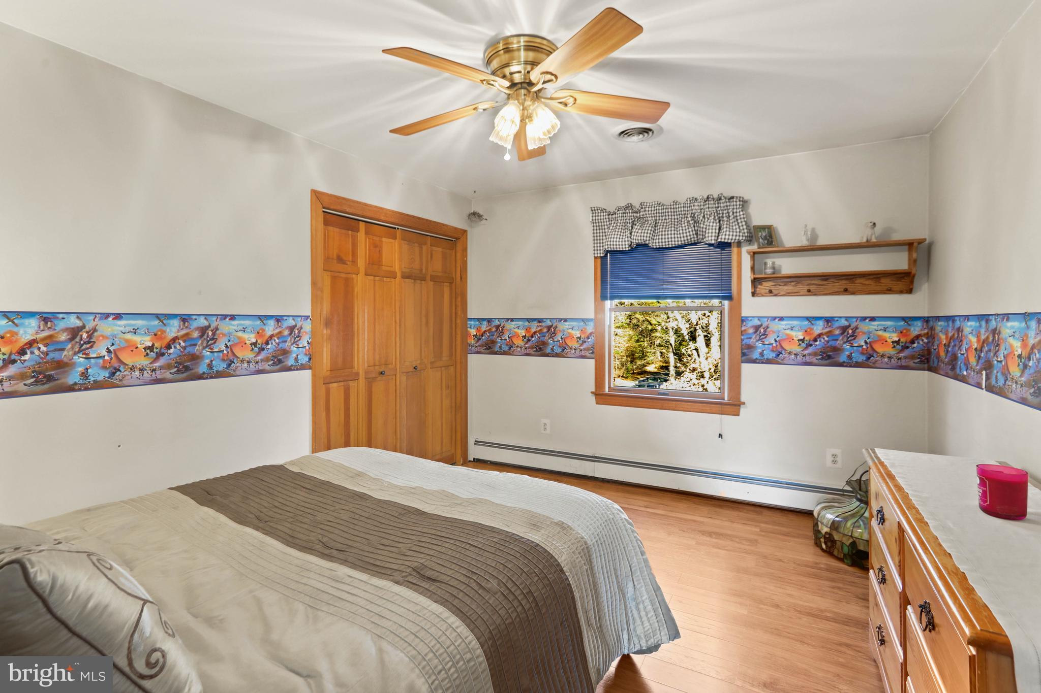 151 Patty Bowker Road Tabernacle, NJ 08088 - Photo 26 of 52 a bedroom with a bed and a chandelier