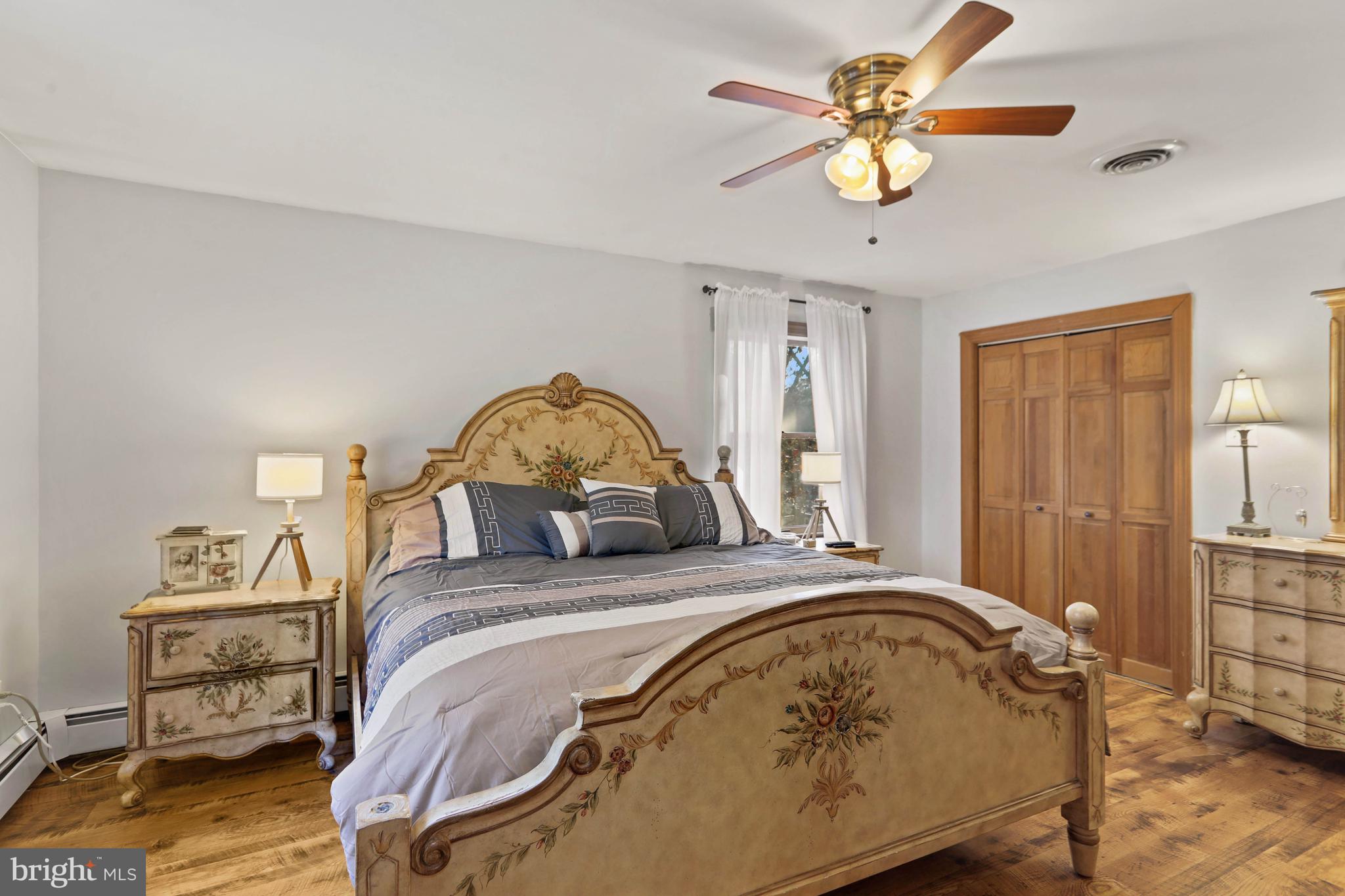 151 Patty Bowker Road Tabernacle, NJ 08088 - Photo 30 of 52 a bedroom with a bed and a chandelier
