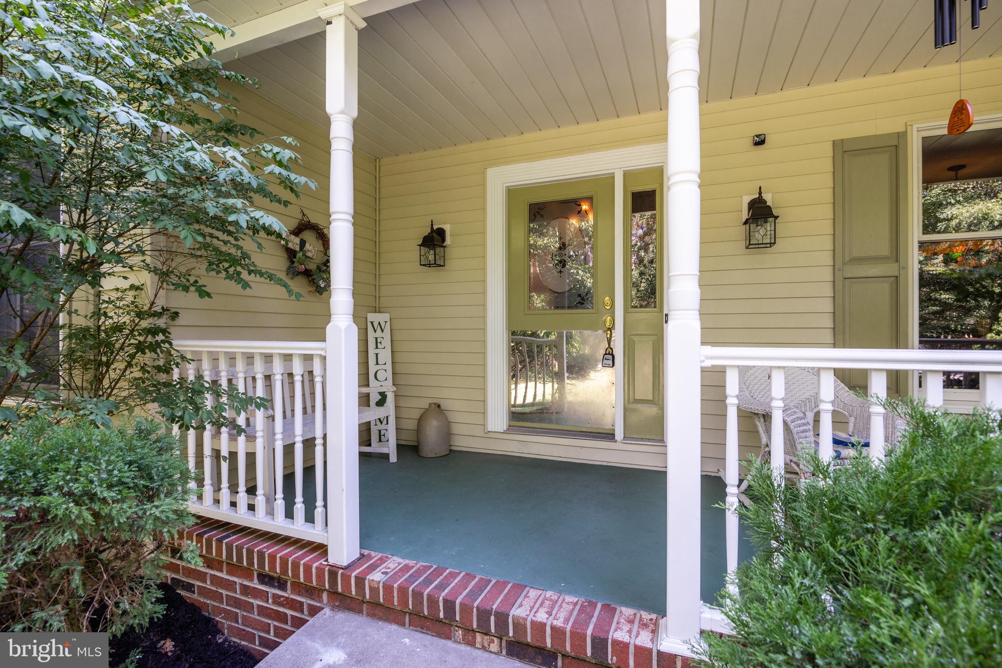 151 Patty Bowker Road Tabernacle, NJ 08088 - Photo 3 of 52 a view of a balcony with a potted plants and wooden fence