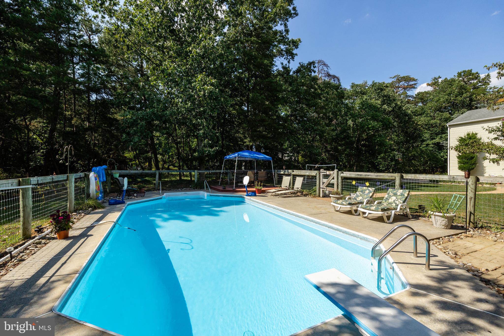 151 Patty Bowker Road Tabernacle, NJ 08088 - Photo 36 of 52 a view of a swimming pool with chairs