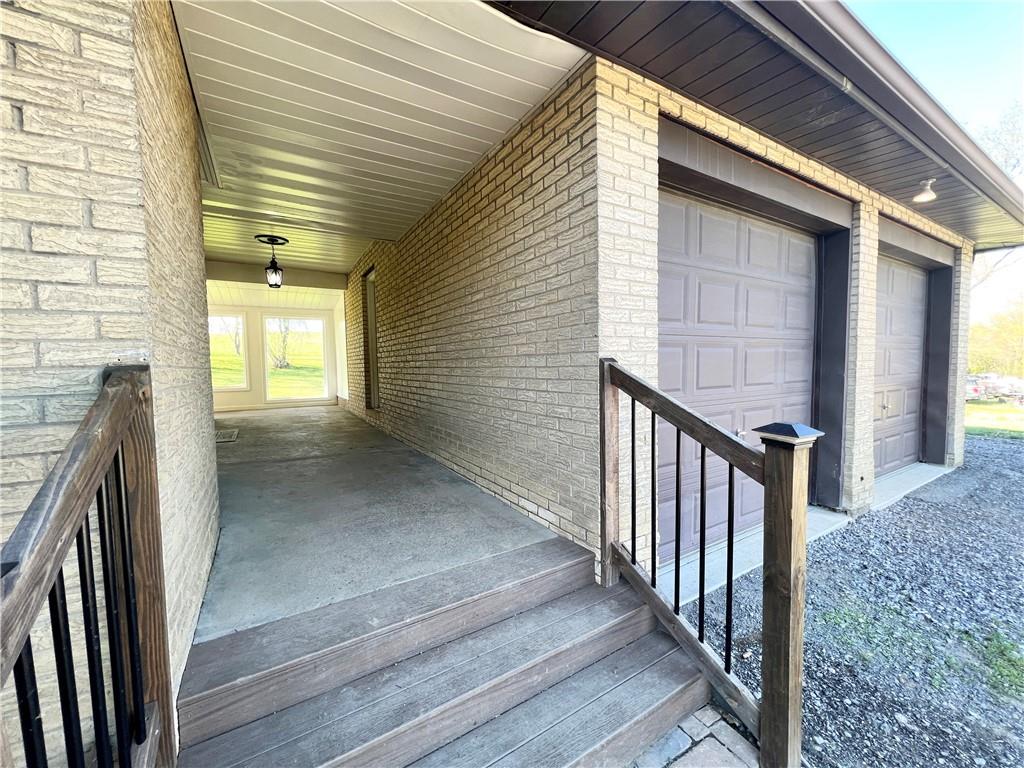 2175 Frew Mill Road New Castle, PA 16101 - Photo 21 of 25 a view of a porch with wooden floor and stairs