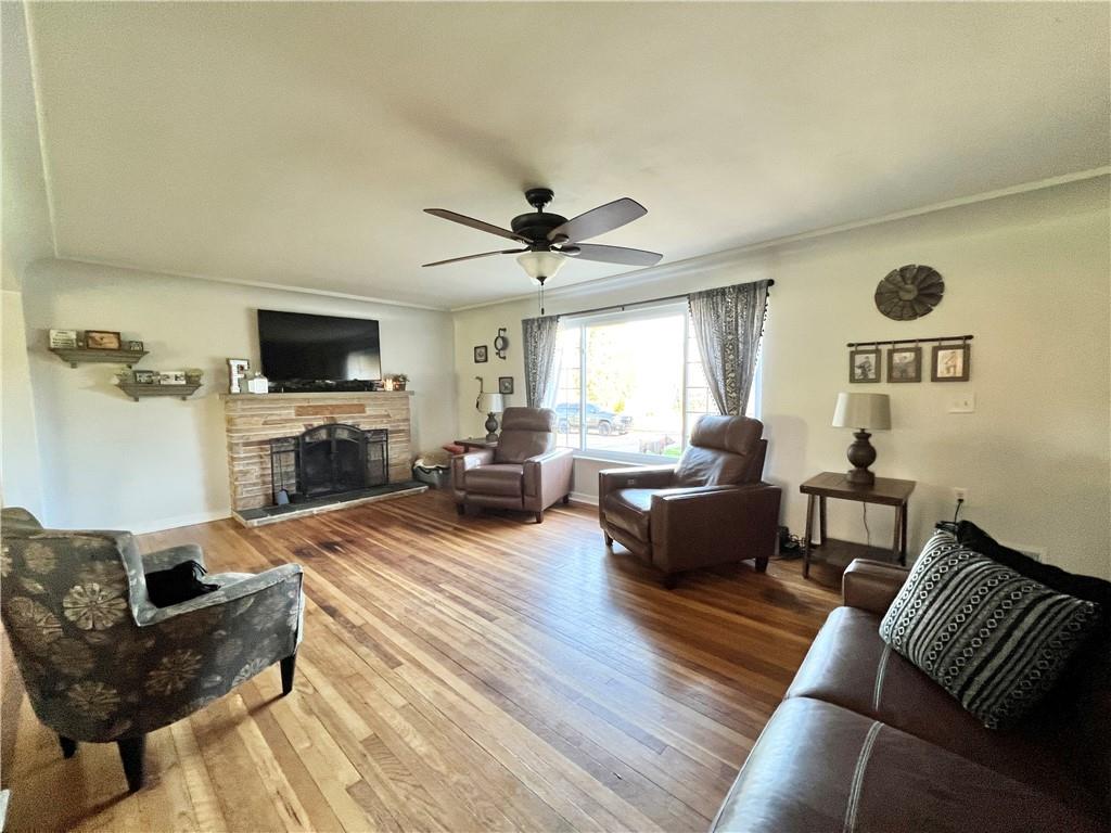 2175 Frew Mill Road New Castle, PA 16101 - Photo 8 of 25 a living room with furniture a fireplace and a flat screen tv