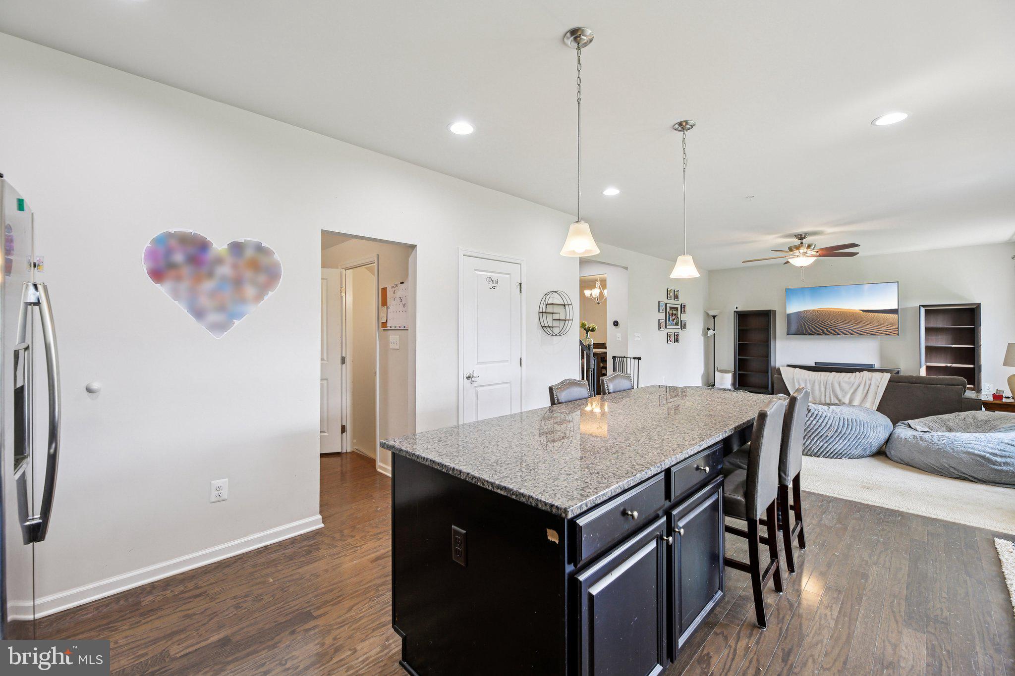 5733 Allender Road White Marsh, MD 21162 - Photo 12 of 47 a view of kitchen island with granite countertop living room
