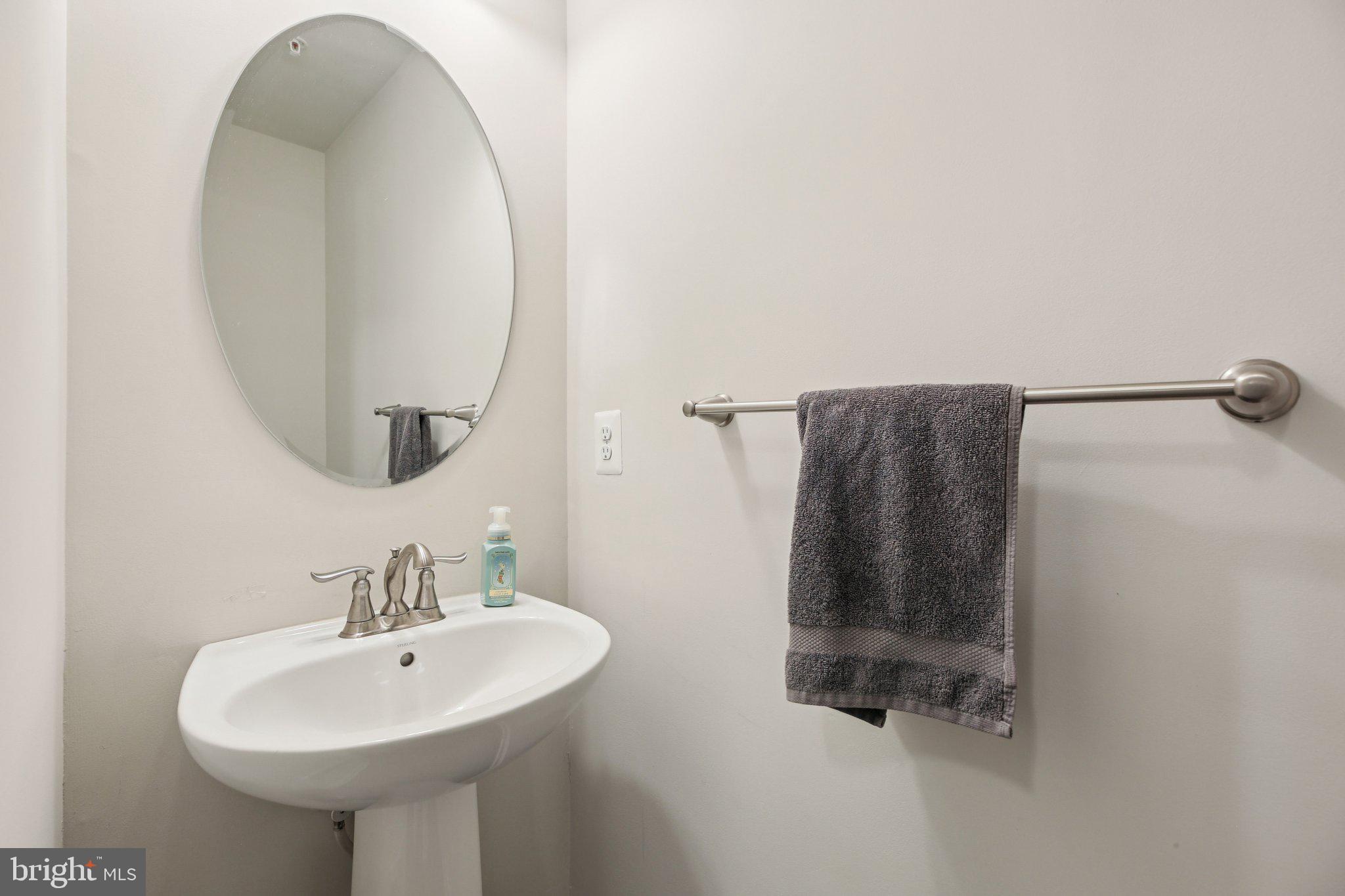 5733 Allender Road White Marsh, MD 21162 - Photo 17 of 47 a bathroom with a sink and mirror