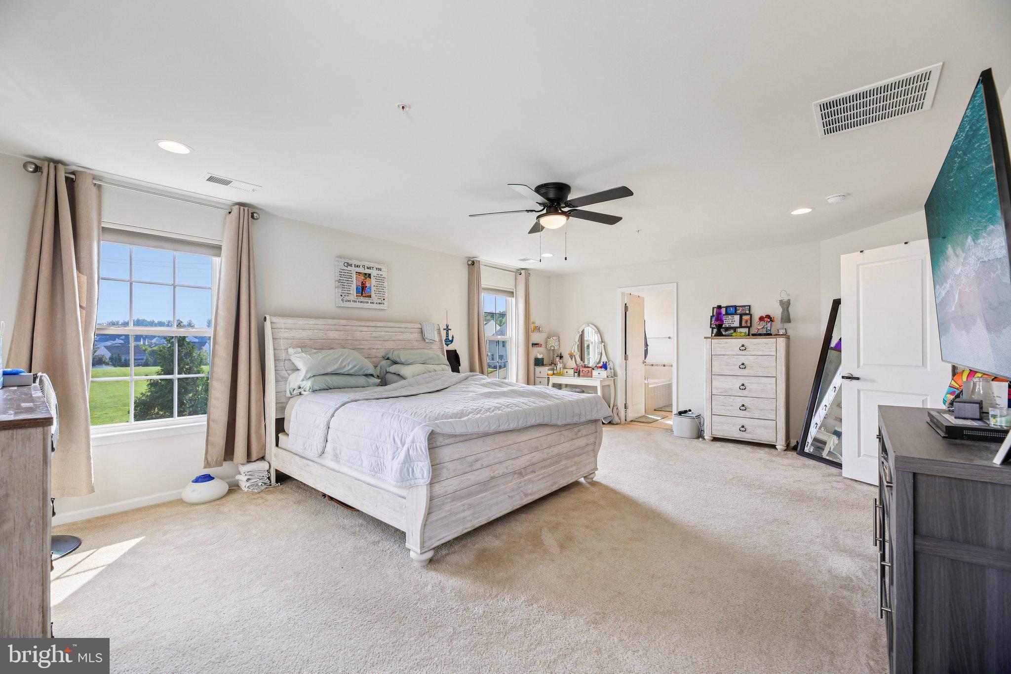 5733 Allender Road White Marsh, MD 21162 - Photo 19 of 47 a spacious bedroom with a bed and a large window