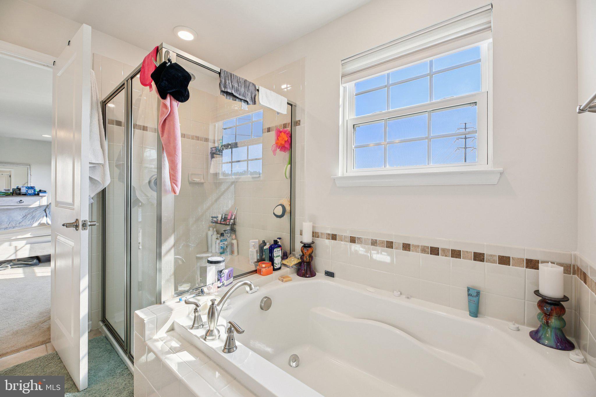 5733 Allender Road White Marsh, MD 21162 - Photo 21 of 47 a bathroom with a bathtub and a shower
