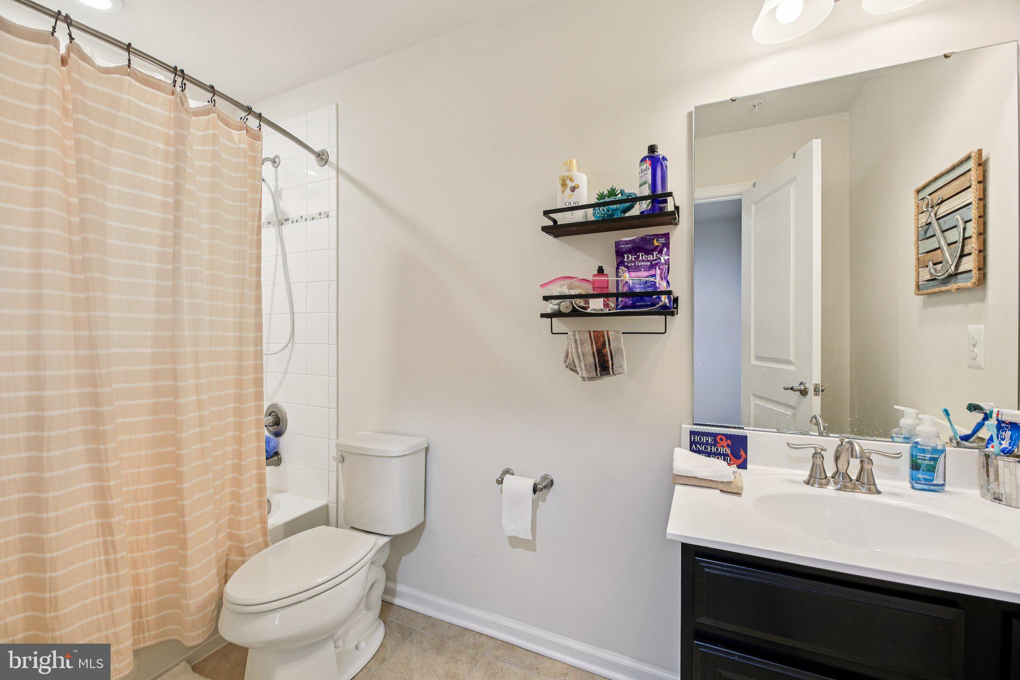 5733 Allender Road White Marsh, MD 21162 - Photo 24 of 47 a bathroom with a sink toilet and shower