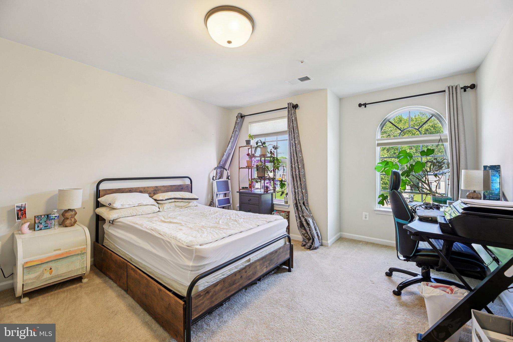 5733 Allender Road White Marsh, MD 21162 - Photo 25 of 47 a bed room with a bed and a desk