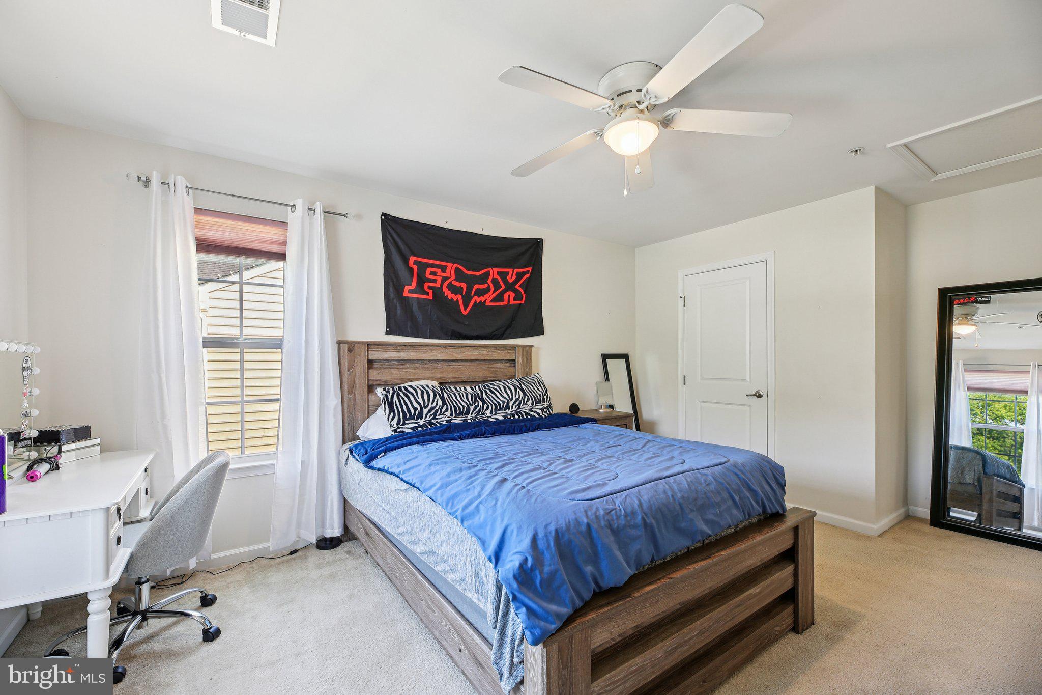 5733 Allender Road White Marsh, MD 21162 - Photo 28 of 47 a bedroom with a bed and a table in it