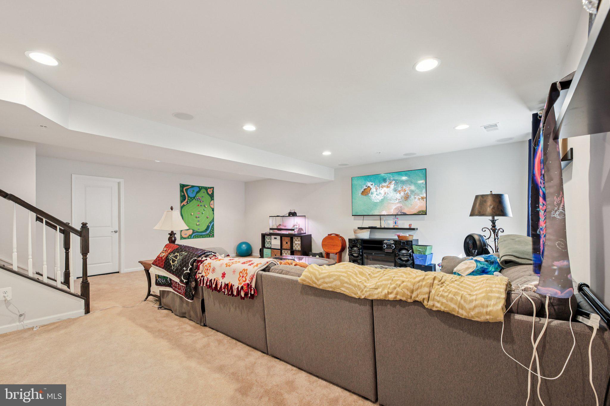 5733 Allender Road White Marsh, MD 21162 - Photo 30 of 47 a bedroom with furniture a flat screen tv and a window