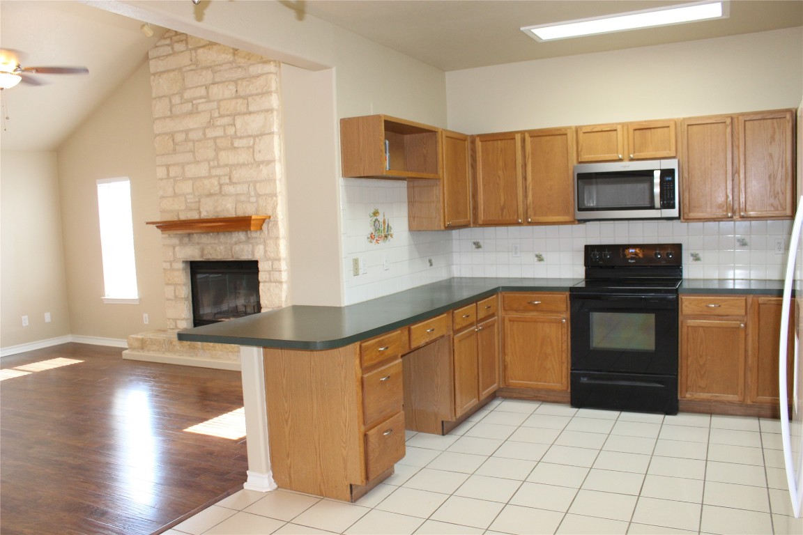 46 Crazy Cross Road Wimberley, TX 78676 - Photo 2 of 10 a kitchen with stainless steel appliances a stove sink and cabinets