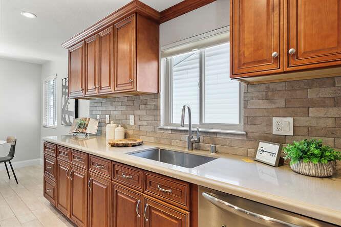 1129 Rainier Avenue Pacifica, CA 94044 - Photo 11 of 41 a kitchen with stainless steel appliances granite countertop a sink and a window