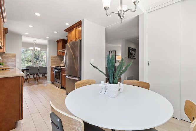 1129 Rainier Avenue Pacifica, CA 94044 - Photo 14 of 41 a dining room with furniture and wooden floor