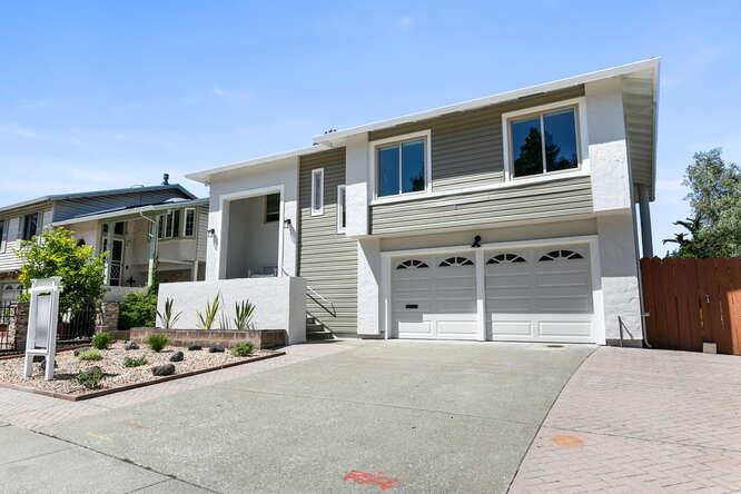 1129 Rainier Avenue Pacifica, CA 94044 - Photo 2 of 41 a front view of a house with a yard