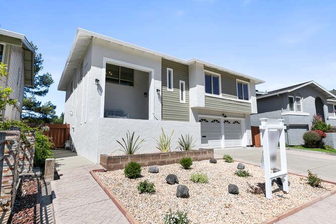 1129 Rainier Avenue Pacifica, CA 94044 - Photo 3 of 41 a view of a white house with a bath tub