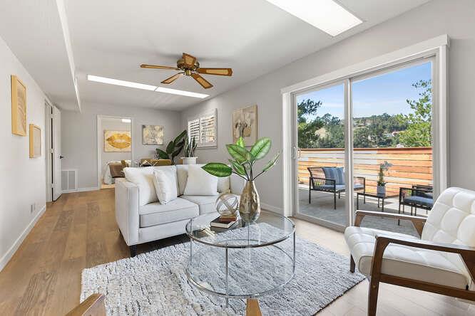 1129 Rainier Avenue Pacifica, CA 94044 - Photo 31 of 41 a living room with furniture and a large window