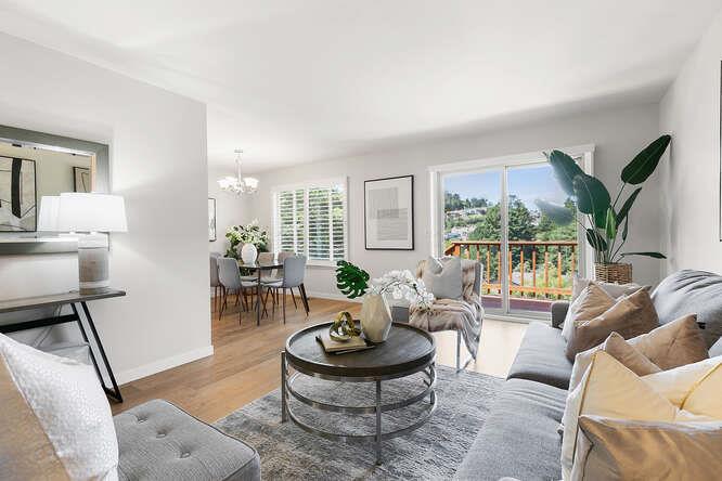 1129 Rainier Avenue Pacifica, CA 94044 - Photo 9 of 41 a living room with furniture and a large window