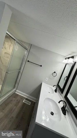a bathroom with a sink and mirror